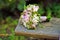 Bridal bouquet on a wooden bench