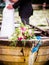 The bridal bouquet is on the wooden boat at the wedding shoot, a