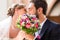 Bridal couple giving kiss in church at wedding