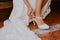 Bridal detail put on a shoe on a rustic floor