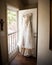 Bridal dress hanging on door