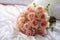 Bridal elegance flowers arranged on a pristine white bed