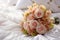 Bridal elegance flowers arranged on a pristine white bed