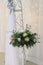 Bridal flower composition on stand on floor for wedding