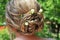 A Bridal Hair Arrangement with Rosebuds.