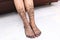 Bridal mehendi of legs on Indian bride at indian mehendi function