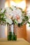 A bridal wedding bouquet in a glass jar before the wedding ceremony, White and pink flowers