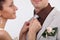 Bride adjusting groom\'s tie