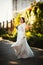 Bride on a background of trees in the park.