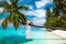 Bride on the beach. Stylish female model in elegant long gown dress on the Maldives beach. Elegance. Bride on Maldives. Bridal