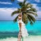 Bride on the beach. Stylish female model in elegant long gown dress on the Maldives beach. Elegance. Bride on Maldives. Bridal