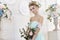 Bride in a beautiful turquoise dress in anticipation of wedding. Blonde in lace dress sea green with a bouquet . Happy bride