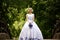 Bride in beauty wedding dress standing on bridge