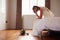 Bride In Bedroom Having Second Thoughts Before Wedding