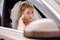 Bride blonde in a wedding car