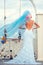 Bride with blue veil near swing