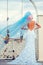 Bride with blue veil near swing