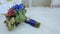 Bride bouquet of blue flowers tied with satin ribbon and brooch decoration of gold crystal ring