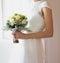 Bride With Bouquet In Dreamy Soft Window Light