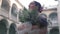 Bride with a bouquet of flowers on the balcony