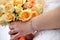 Bride with a bouquet of roses waiting for the groom