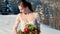 bride with a bouquet in winter