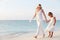 Bride With Bridesmaid At Beautiful Beach Wedding