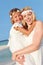 Bride With Bridesmaid At Beautiful Beach Wedding