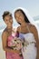 Bride and Bridesmaid smiling on beach