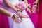 Bride and bridesmaids with a bouquet and decorations on their hands