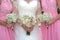 Bride and bridesmaids holding Bouquet