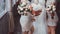 Bride and bridesmaids holding bouquets