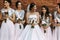 Bride with the bridesmaids in the shining dresses