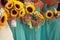 Bride and bridesmaids with sunflowers bouquet