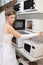 Bride choosing microwave oven