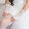 Bride corrects garter on her leg