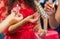 The bride decorated with a decorative candlestick in her hands and a sign . holds a candle in her hand . in the background without