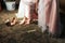 Bride dresses shoes before the wedding ceremony. Charges of the bride. Closeup detail of bride putting on high heeled sandal