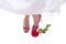 Bride feet in red shoes with rose