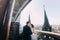 Bride and fiance have sensual moment on the balcony of old Gothic cathedral