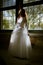 Bride in front of a window