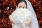 Bride giving flower or bouquet in her hands with a copy space