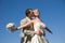 Bride and groom against blue sky