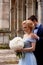Bride and groom on the background of an old estate. Classical wedding. Wedding walk and photo shoot. Embraces