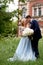 Bride and groom on the background of an old estate. Classical wedding.Wedding walk and photo shoot. Embraces and kiss