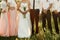 bride and groom with bridesmaids and groomsmen posing in sunlight evening in mountains. gorgeous wedding couple