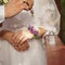 Bride and groom close-up hands and lock with keys