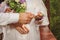 bride and groom close-up hands and lock with keys