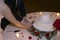 Bride and Groom Cut Wedding Cake by Candlelight