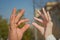 Bride and groom doing the infinity sign combining their wedding rings . men and woman married with hands and rings . the two rings